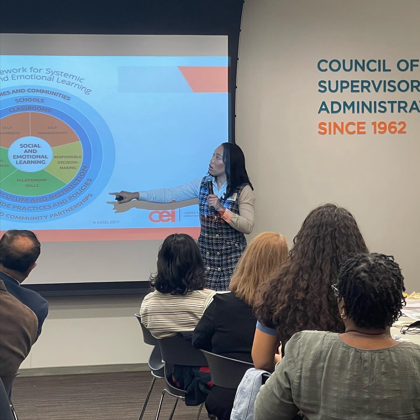 CEI facilitator presenting social and emotional learning to educators